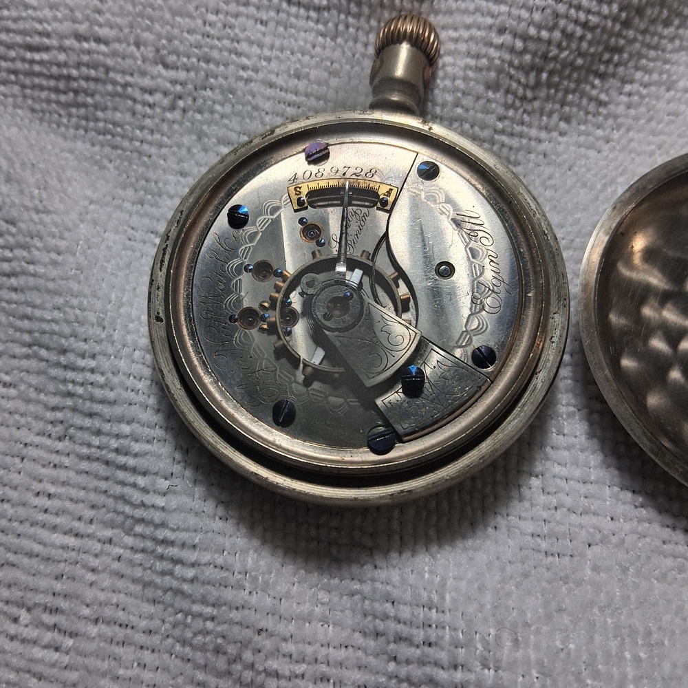 Silver Pocket Watch with Intricate Design